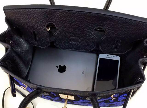 Blue tote with black scroll design